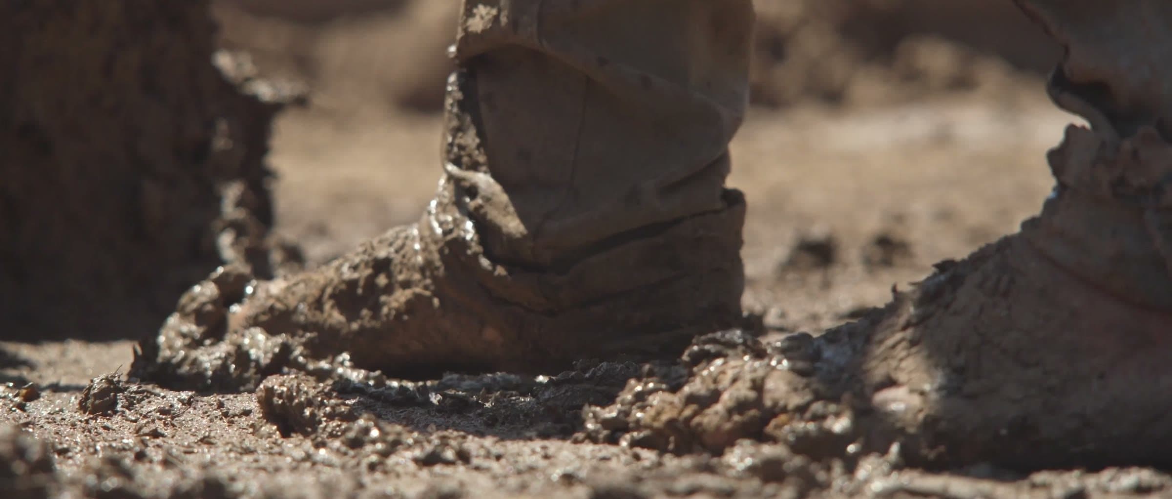 Boots treading the mud