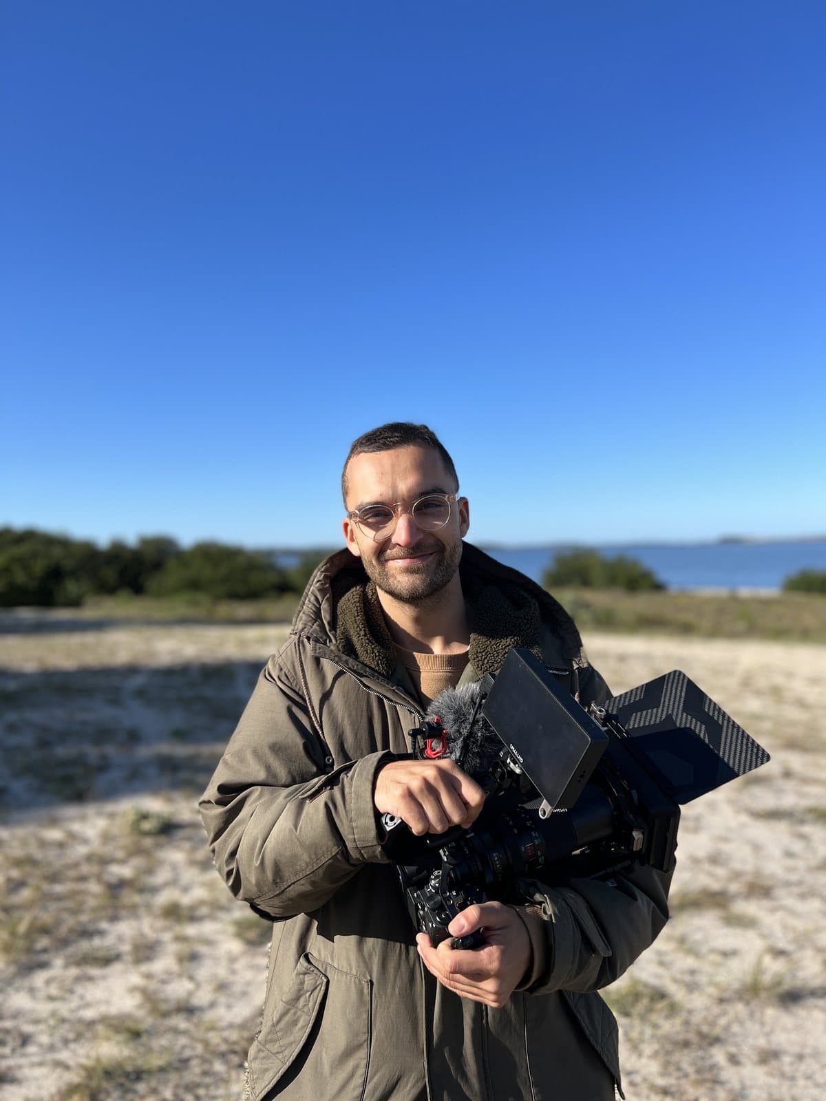 Nando with the camera on the coast