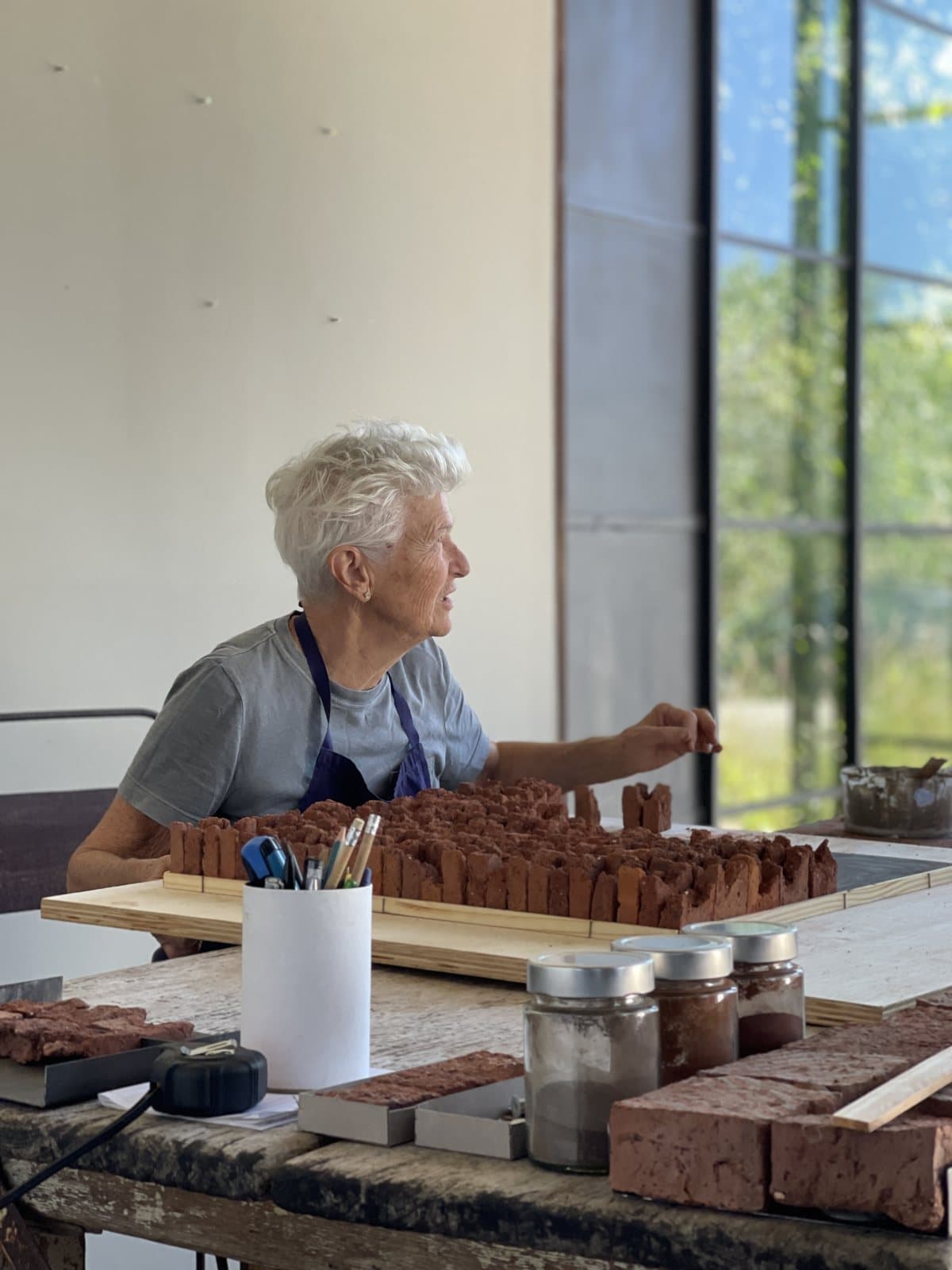Heloísa Crocco assembling a work in her studio