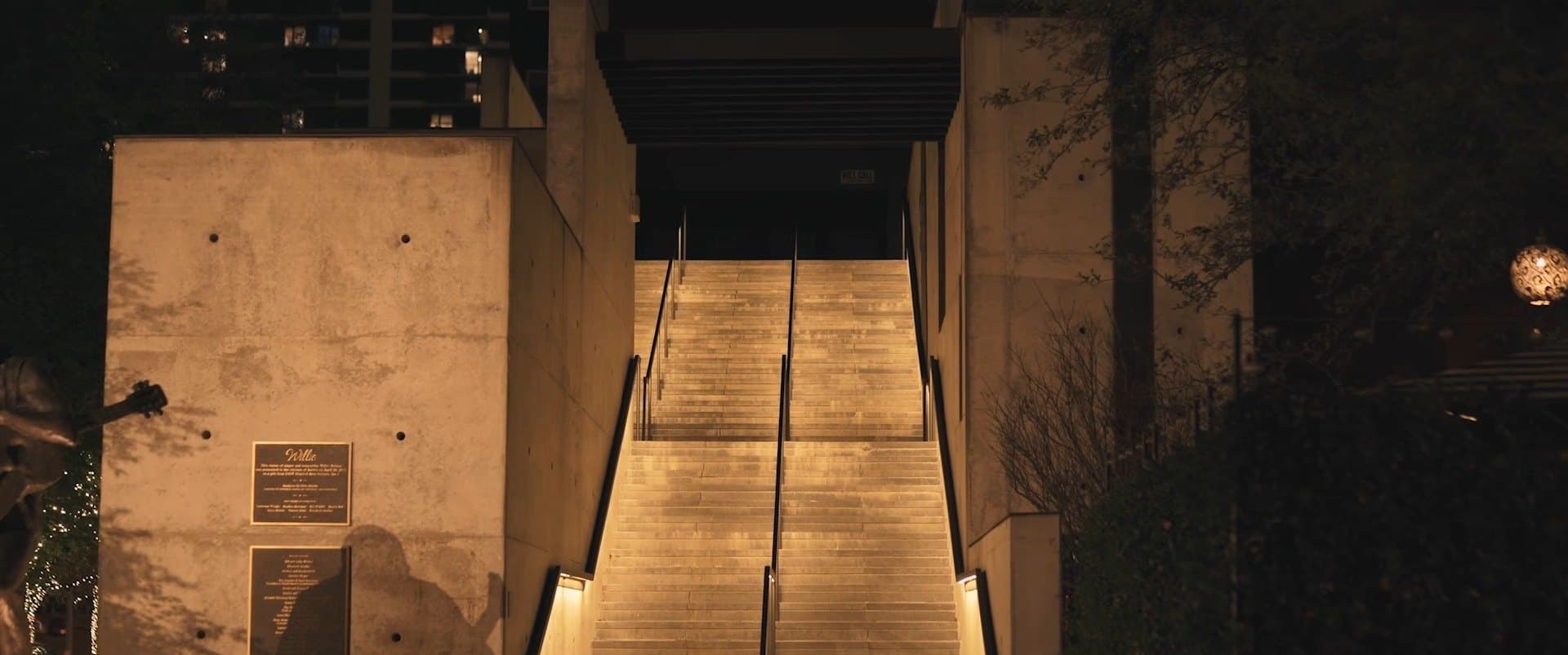 A lit staircase at night