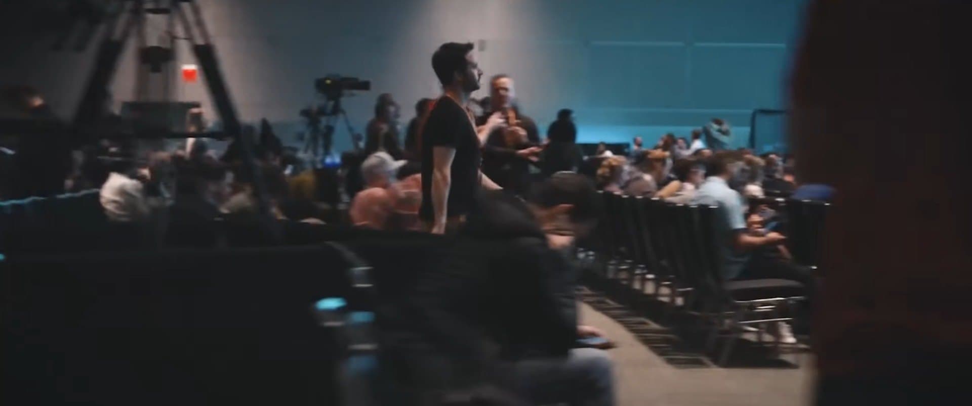 A dark room full of people