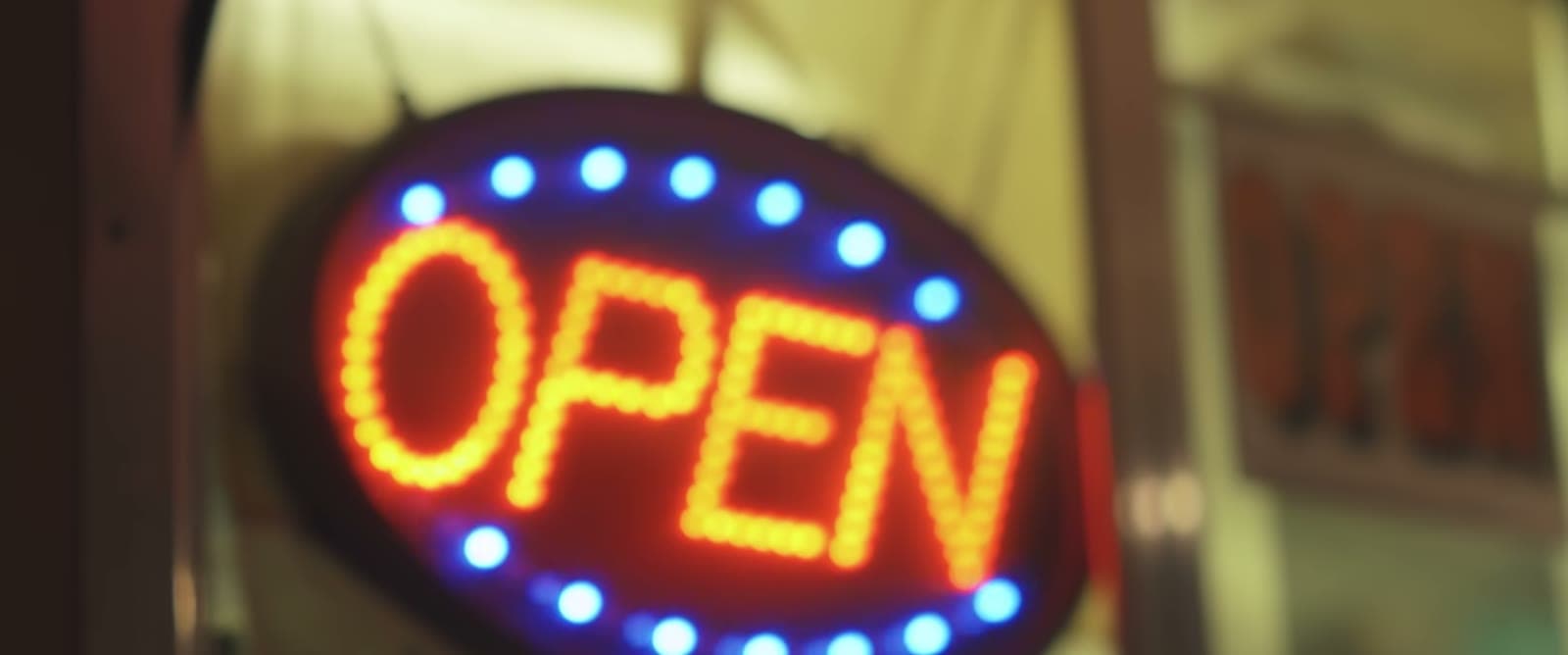 The lit OPEN sign