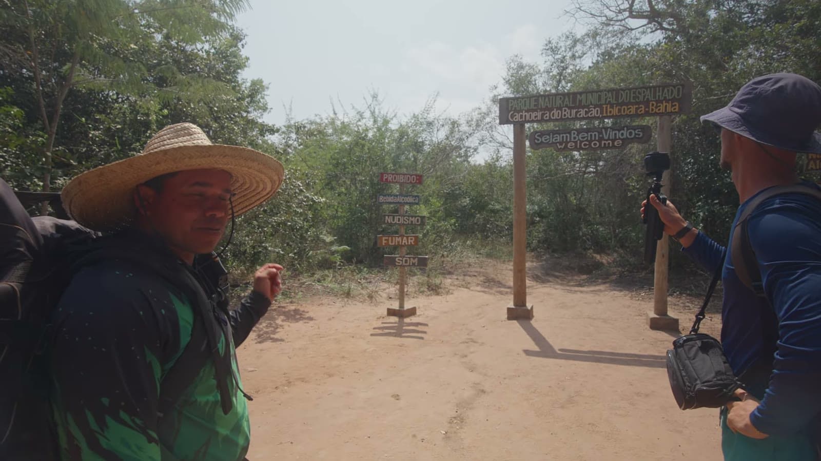 Our guide Antônio, in a straw hat, at the sign marking the start of the Buracão trail
